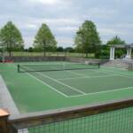 Sunken All Weather Court Two Tone with custom fencing and Basketball Backboard